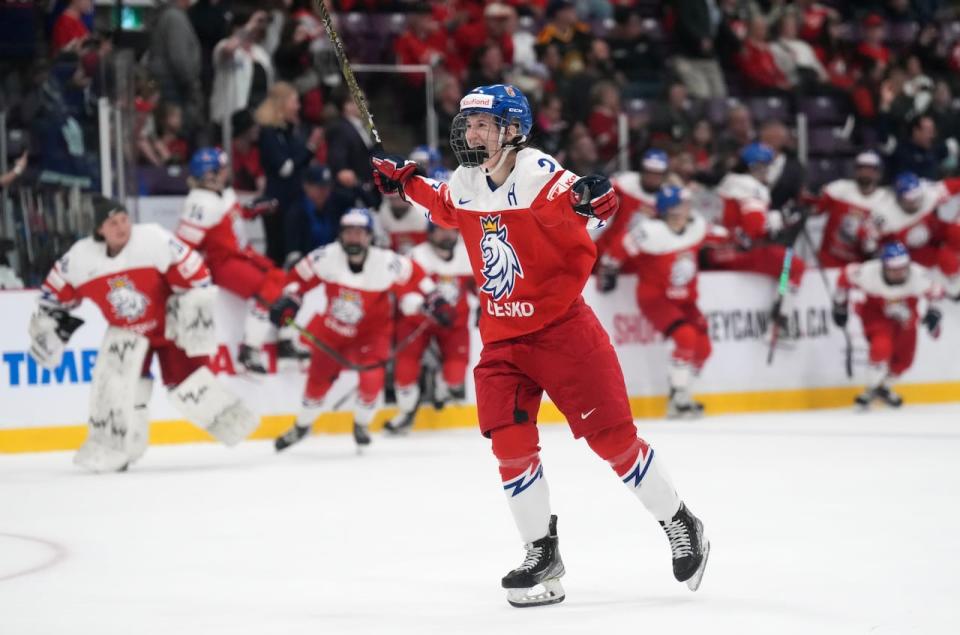 Czechia defender Aneta Tejralova celebrates with teammates after winning a bronze medal at the Women's World Championships in Brampton, Ont. this past spring.