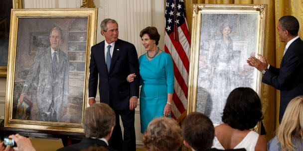 PHOTO: In this May 31, 2012 file photo President Barack Obama applauds former President George W. Bush and former first lady Laura Bush during a ceremony in the East Room of the White House in Washington D., where the Bush's portraits were unveiled.  (Charles Dharapak/AP, FILE)