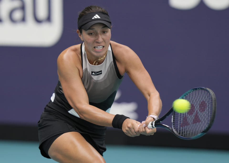 Jessica Pegula returns to Katherine Sebov of Canada during the Miami Open tennis tournament, Thursday, March 23, 2023, in Miami Gardens, Fla. (AP Photo/Marta Lavandier)