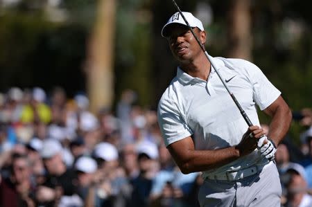 Feb 16, 2018; Pacific Palisades, CA, USA; Tiger Woods looks at his shot from the second tee during the second round of the Genesis Open golf tournament at Riviera Country Club. Mandatory Credit: Orlando Ramirez-USA TODAY Sports