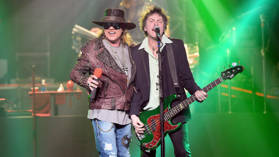 Singer Axl Rose (L) and bassist Tommy Stinson of Guns N' Roses perform at The Joint inside the Hard Rock Hotel & Casino during the opening night of the band's second residency, 