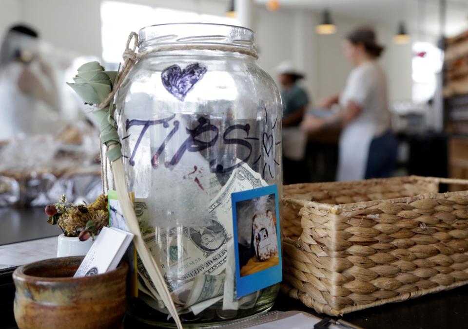 A tip jar sits on a counter at Zak the Baker in Miami on June 20, 2018.