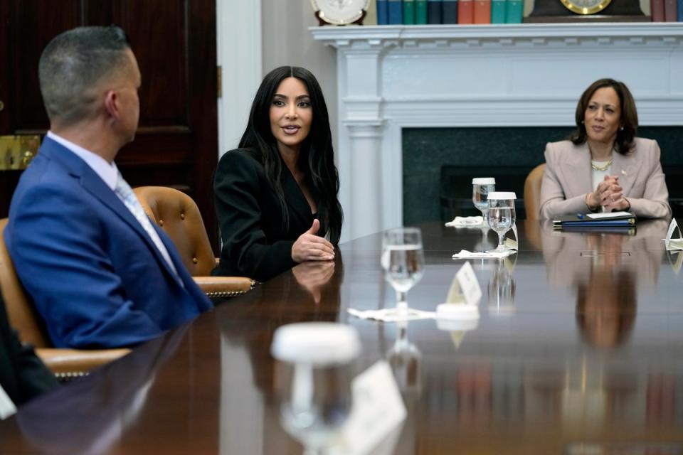 Vice President Kamala Harris listens as Kim Kardashian speaks during a discussion in the Roosevelt Room of the White House in Washington, on 25  April 2024 (AP)