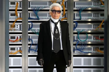 German designer Karl Lagerfeld appears at the end of his Spring/Summer 2017 women's ready-to-wear collection for fashion house Chanel. REUTERS/Charles Platiau