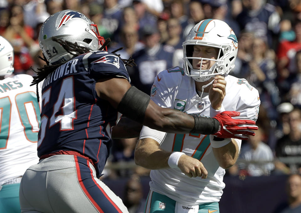 New England Patriots linebacker Dont'a Hightower (54) pressures Miami Dolphins quarterback Ryan Tannehill (17) during the first half of an NFL football game, Sunday, Sept. 30, 2018, in Foxborough, Mass. (AP Photo/Steven Senne)