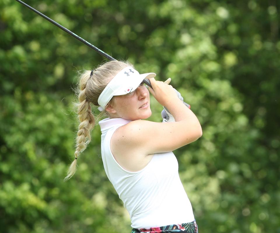 Chloe McFaddin follows the flight path of her shot off the first tee at Otis Park Saturday in the Bedford Junior City Tournament