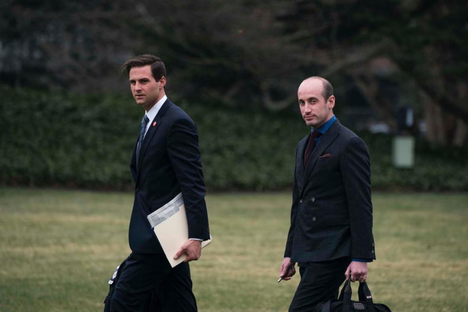 Personal aide to the President John McEntee (L) and White House senior advisor for policy Stephen Miller walk along the South Lawn to Marine One as they depart from the White House on March 2, 2020.