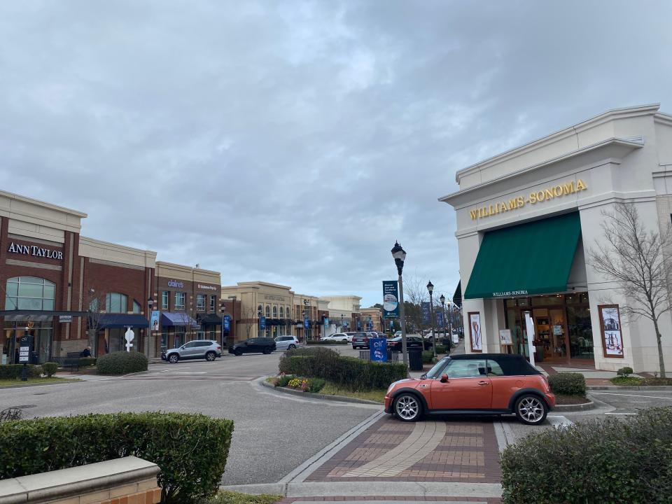 A major intersection of Mayfaire flanked by Williams-Sonoma and Altar'd State.