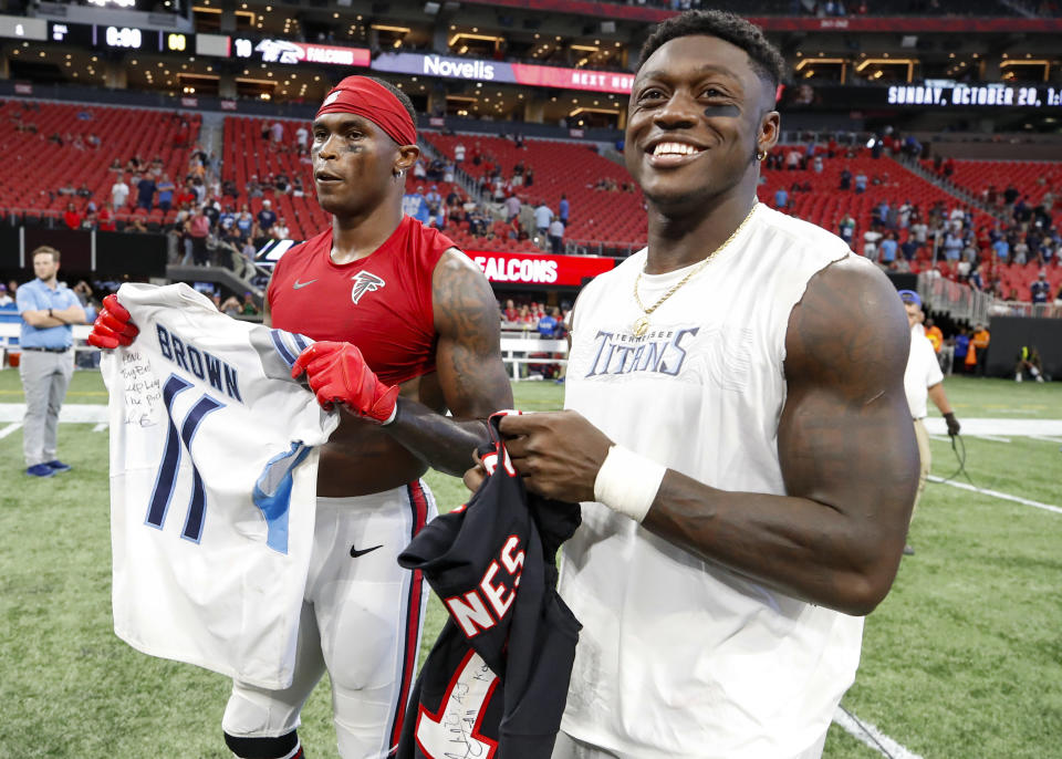 Julio Jones #11 of the Atlanta Falcons swaps jerseys with A.J. Brown #11 of the Tennessee Titans at the conclusion of an NFL game at Mercedes-Benz Stadium on September 29, 2019 in Atlanta, Georgia. (Photo by Todd Kirkland/Getty Images)