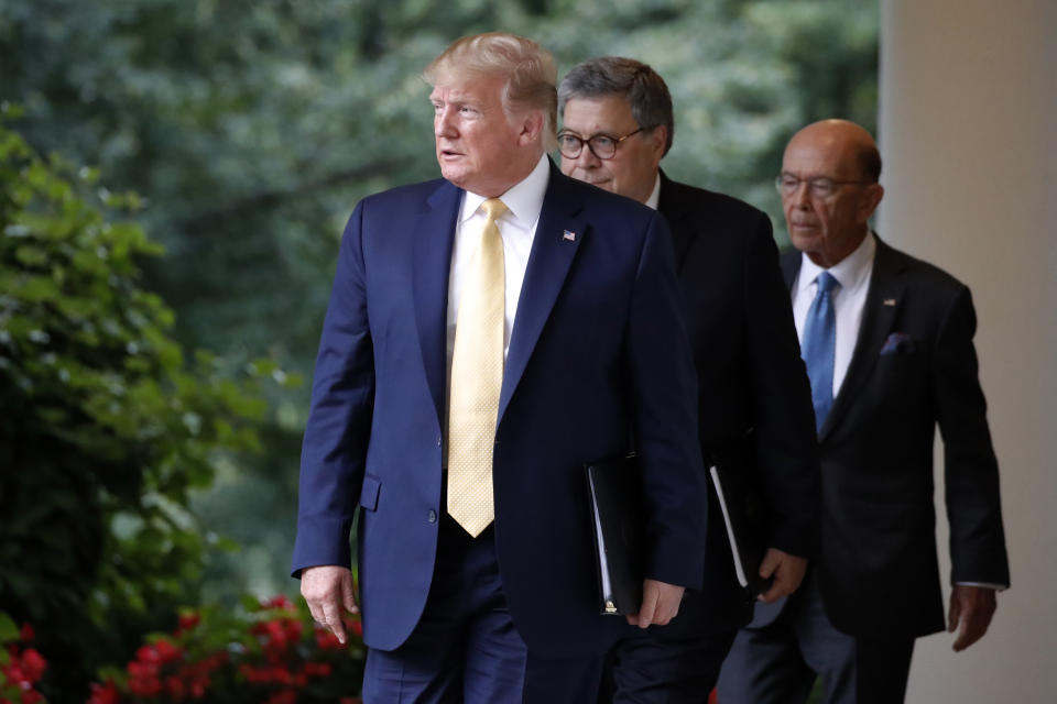President Donald Trump arrives with Commerce Secretary Wilbur Ross and Attorney General William Barr as he speaks in the Rose Garden at the White House in Washington, Thursday, July 11, 2019. (AP Photo/Alex Brandon)