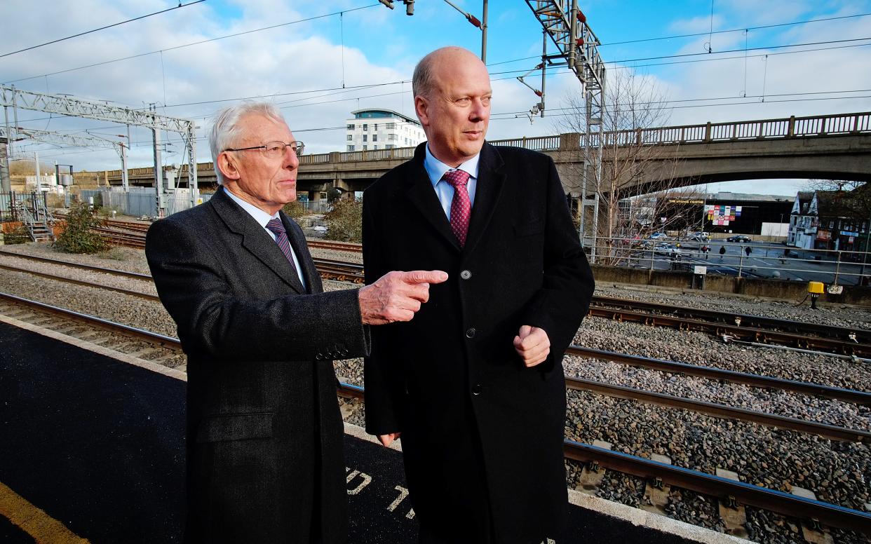 Cyril Bleasdale,(82), who cut the first sod on the viaduct in the background in 1962, with Transport Secretary Chris Grayling launching the East West Railway Co at Bletchley Station, Bucks. - Photo by John Robertson Â© www.jr-photos.com