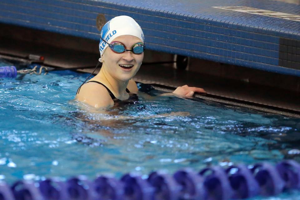 Stillwater's Avery Littlefield finishes the 100-yard freestyle during the Class 6A state meet at Edmond Schools Aquatic Center on Feb. 19. 2022.