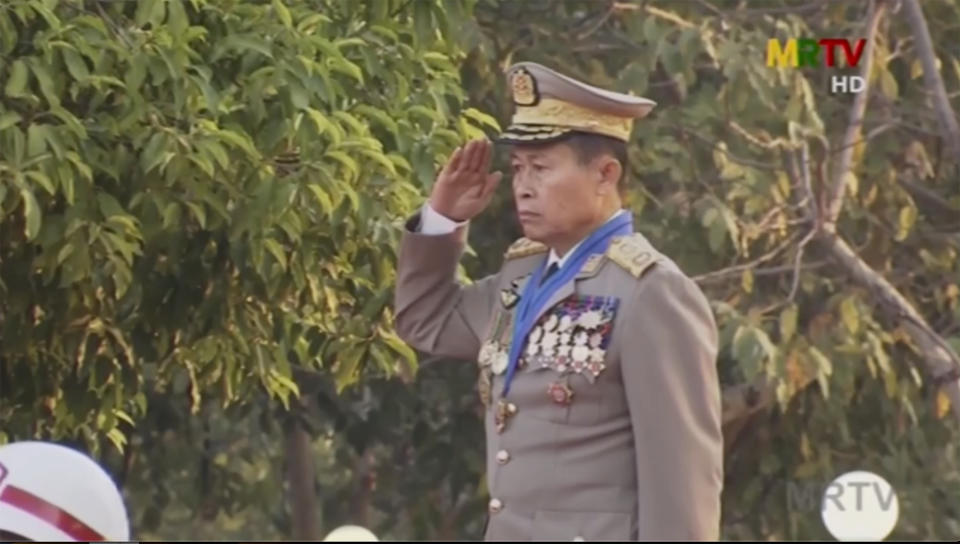 In this image taken from MRTV video, Deputy Commander in chief, Vice Senior Gen. Soe Win salutes during a flag-raising ceremony to mark Union Day in Naypyitaw, Myanmar Friday, Feb. 12, 2021. The Biden administration announced Thursday that new sanctions against Myanmar will target the country's top military officials who ordered this month's coup in the Southeast Asian country. The sanctions name top military commander Min Aung Hlaing and his deputy Soe Win, as well as four members of the State Administration Council. (AP Photo)