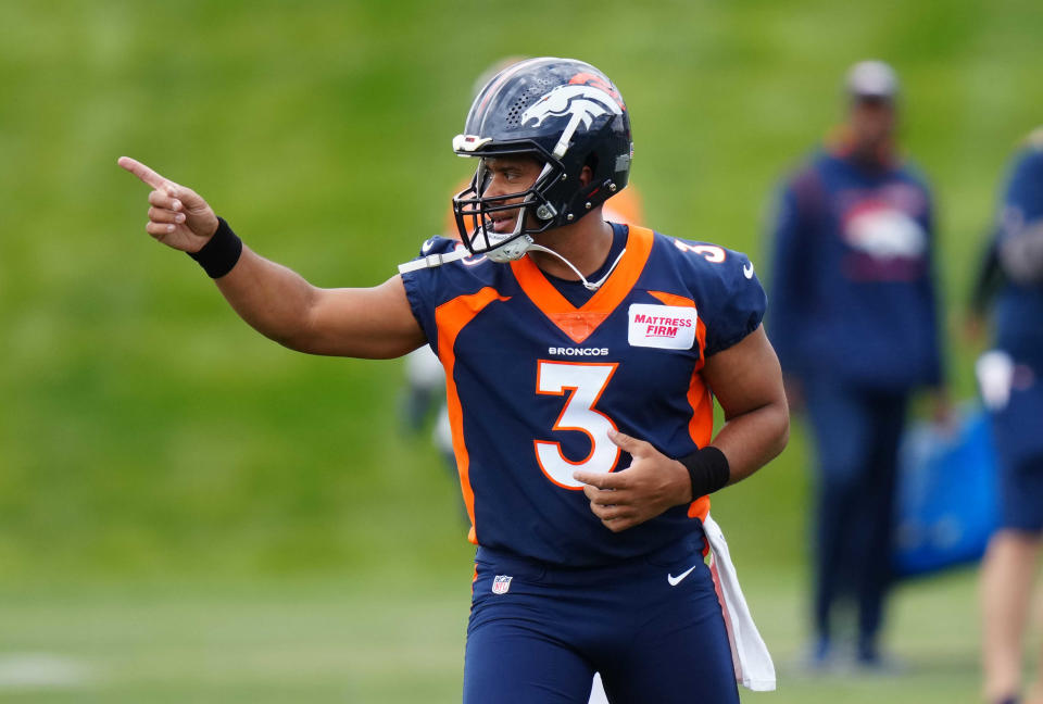 Russell Wilson takes part in the Broncos' OTA workouts.