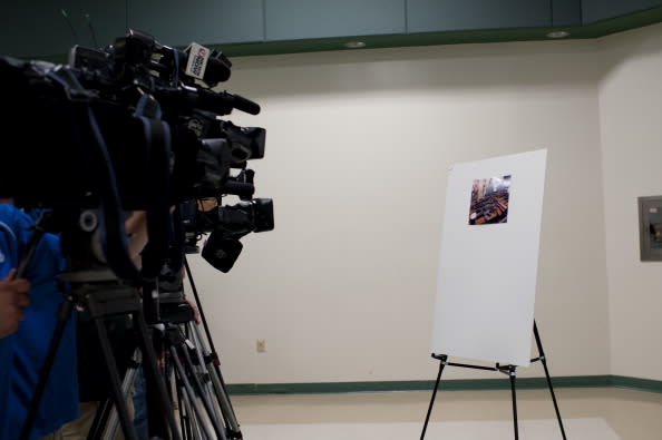 Photos of the arsenal that the Anne Arrundel County Police found are shown during a press conference on the arrest of Neil E. Prescott at the Prince George's County Police Headquarters on July 27, 2012 in Landover, Maryland. Prescott was in the process of being terminated from his job at Pitney Bowes when he made threats toward his employer, a search of his home tuned up an arsenal of weapons. (Photo by Kris Connor/Getty Images)