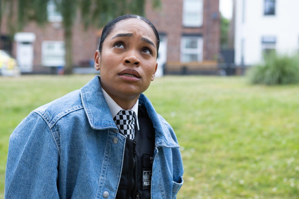 Tahirah Sharif as PC Lizzie Adama in her police uniform and denim jacket.