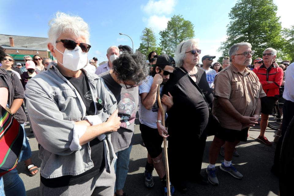 Hundred attend a prayer vigil May 15, 2022 across the street from the Tops supermarket in Buffalo, N.Y. where a gunman killed ten people Saturday.