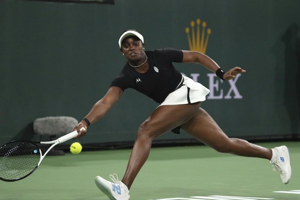 Sloane Stephens returns a shot to Sofia Kenin at the BNP Paribas Open tennis tournament Thursday, March 9, 2023, in Indian Wells, Calif. (AP Photo/Mark J. Terrill)