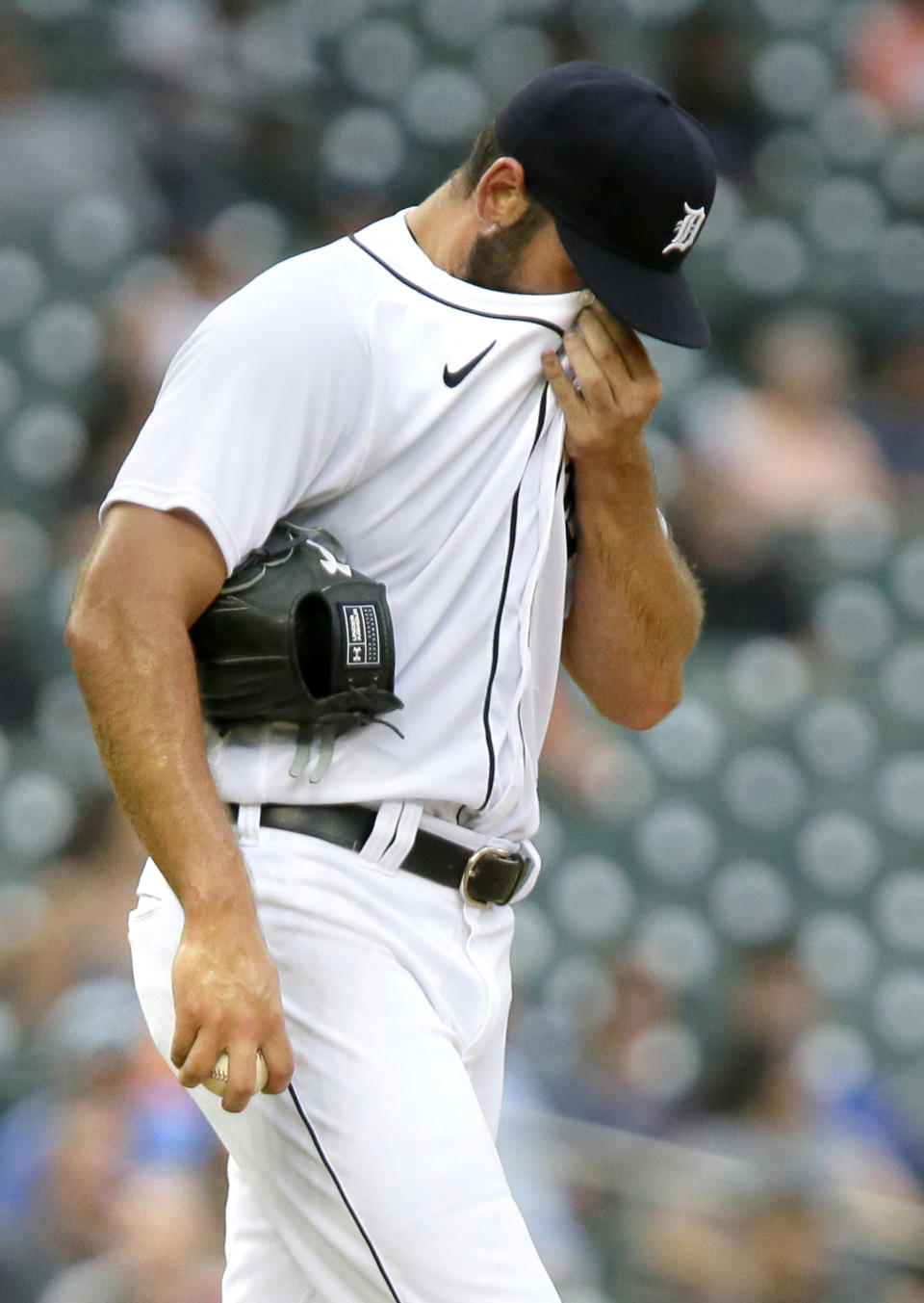 Detroit Tigers' Michael Fulmer walks back to the mound after giving up the go-ahead home run to Houston Astros' Carlos Correa during the sixth inning of the second baseball game of a doubleheader Saturday, June 26, 2021, in Detroit. (AP Photo/Duane Burleson)