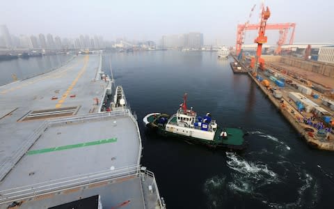 China's first domestically developed aircraft carrier departs Dalian - Credit: Reuters