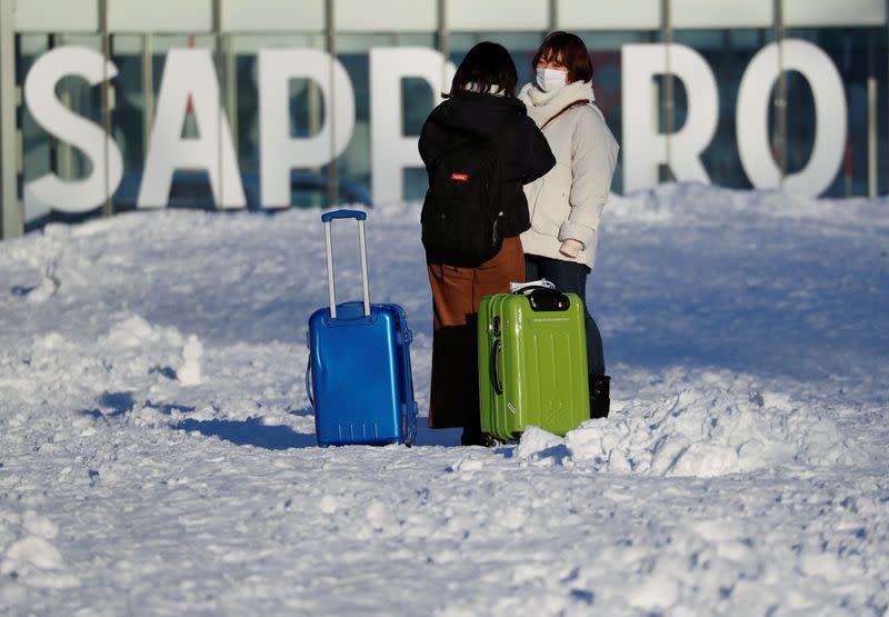 Women wearing protective masks are seen at Sapporo Odori Park in Sapporo, Hokkaido