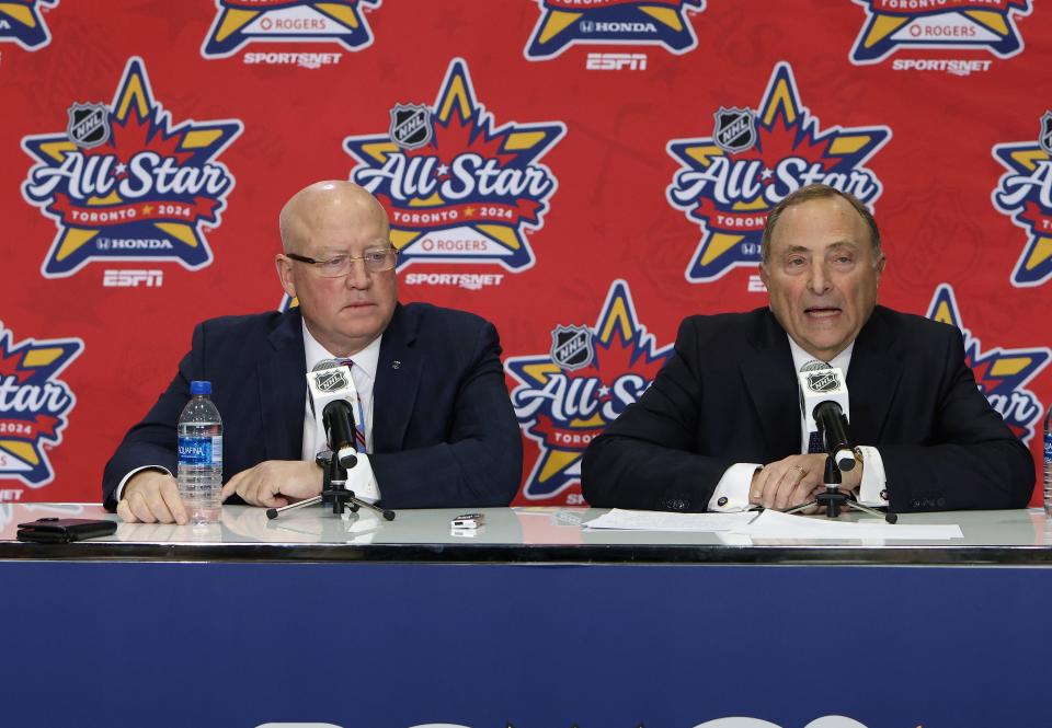 NHL deputy commissioner Bill Daly and commissioner Gary Bettman speak with the media at Scotiabank Arena in Toronto.