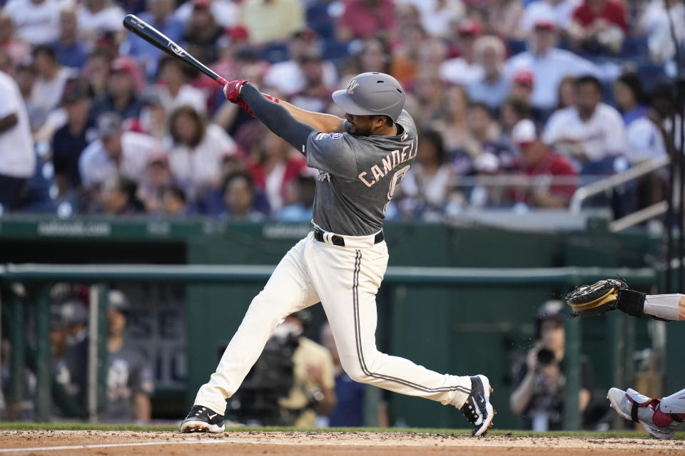 Washington Nationals' Jeimer Candelario doubles in the second inning of a baseball game against the Philadelphia Phillies, Friday, June 2, 2023, in Washington. Alex Call and Luis Garcia scored on the play. (AP Photo/Patrick Semansky)