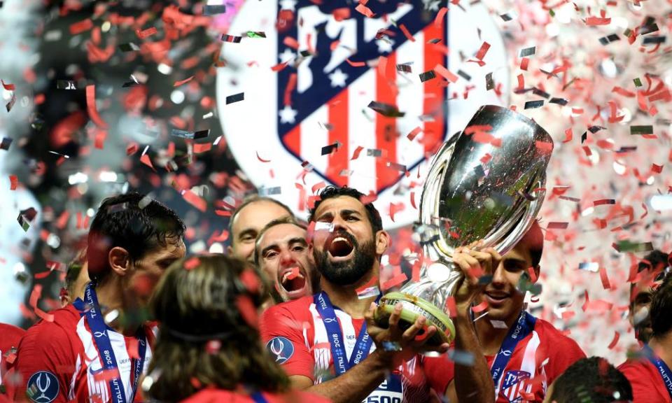 Diego Costa lifts the trophy after his two goals helped Atlético Madrid to win the Super Cup.