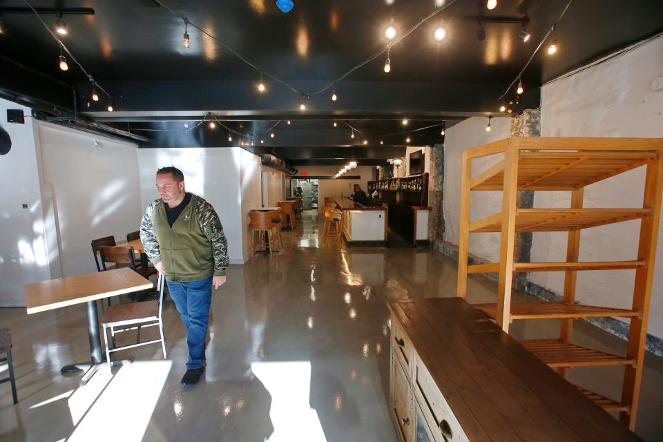 Howie Hallows, co-owner, walks the main floor of the soon to open New Beige restaurant at the bottom of Union Street in New Bedford.