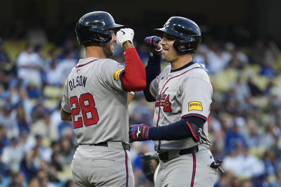 Atlanta Braves' Austin Riley, right, celebrates with Matt Olson (28) after hitting a home run during the first inning of a baseball game against the Los Angeles Dodgers in Los Angeles, Friday, May 3, 2024. (AP Photo/Ashley Landis)