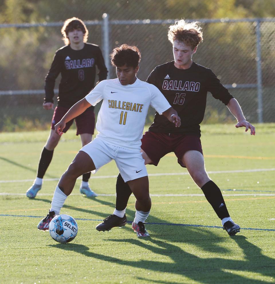Collegiate's Elijah Harper (11) tries to control the ball against Ballard's Scott Jennings (16) during the Seventh Region semifinals Tuesday at the Collegiate soccer complex.