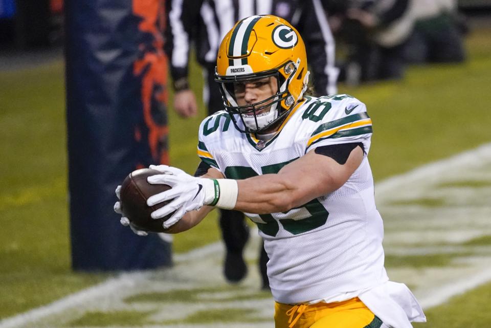 FILE - Green Bay Packers' Robert Tonyan catches a touchdown pass during the first half of an NFL football game against the Chicago Bears in Chicago, in this Sunday, Jan. 3, 2021, file photo. Indiana State hasn’t had anyone drafted in nearly a quarter-century but has two of its former players a game away from the Super Bowl. Both happen to play the same position on the same team. Green Bay Packers tight end Robert Tonyan emerged as one of the league’s breakthrough performers this year. Dominique Dafney went from working at a rooftop patio bar earlier this fall to catching a touchdown pass in the Packers’ regular-season finale.(AP Photo/Nam Y. Huh, File)