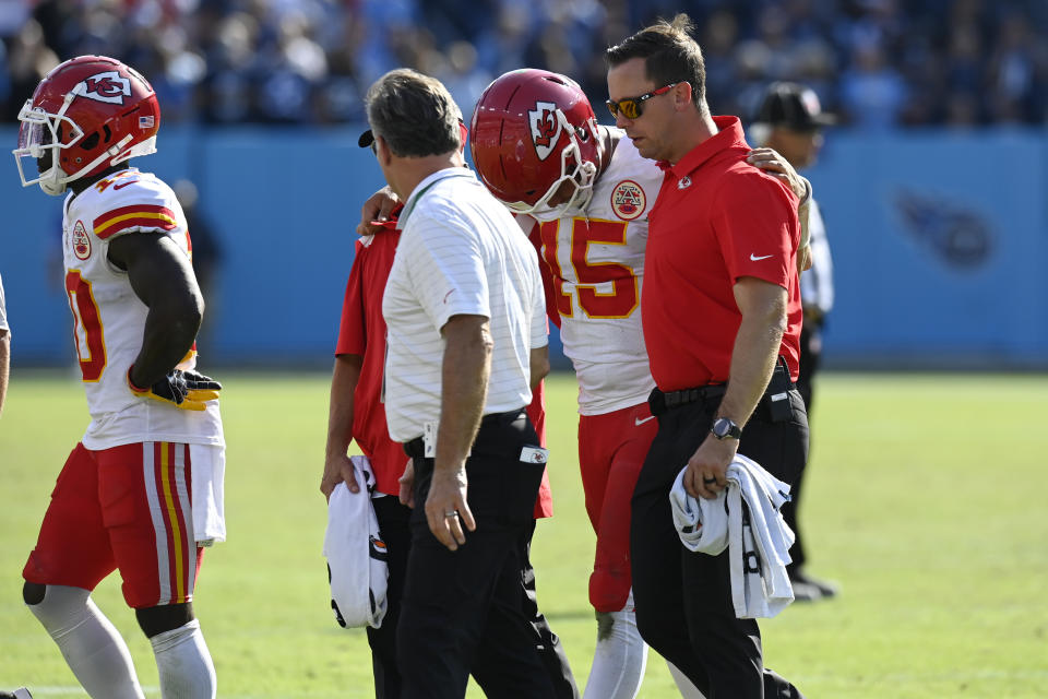 Kansas City Chiefs quarterback Patrick Mahomes (15) is helped off the field after being hit in the second half of an NFL football game against the Tennessee Titans Sunday, Oct. 24, 2021, in Nashville, Tenn. (AP Photo/Mark Zaleski)