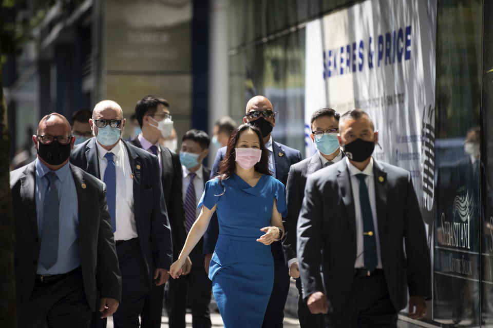 Meng Wanzhou, chief financial officer of Huawei, returns at B.C. Supreme Court after a break in her extradition hearing in Vancouver, British Columbia, Wednesday, Aug. 4, 2021. (Darryl Dyck/The Canadian Press via AP)