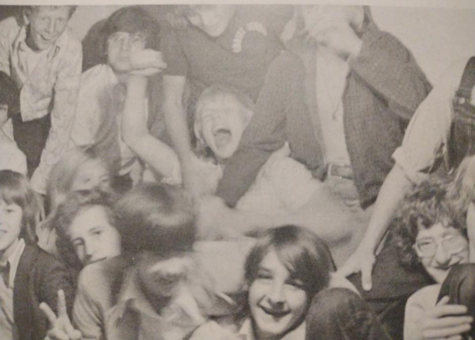 Tom Hill, middle, being grabbed my classmates in a 1974-75 yearbook photo from Christ School.