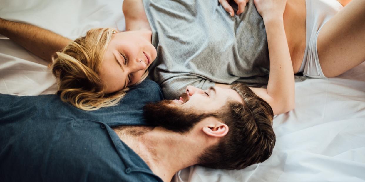 couple laying in bed together more sex after kids