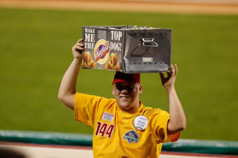 PHOTO: A Hatfield Hot Dog vendor carries a hot dog tray at Citizens Bank Park in Philadelphia, PA, Sep. 3, 2013. (Brian Garfinkel/Getty Images)