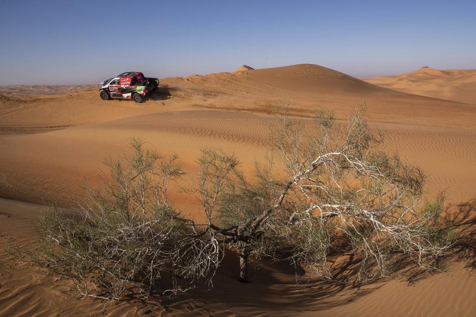 Driver Yazeed Al Qassimi, of Saudi Arabia, and co-driver Konstantin Zhiltsov, of Russia, race their Toyota during stage eleven of the Dakar Rally between Shubaytah and Haradth, Saudi Arabia, Thursday, Jan. 16, 2020. (AP Photo/Bernat Armangue)