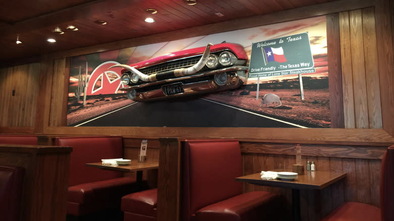 Booths and retro car wall decor Lone Star Steakhouse