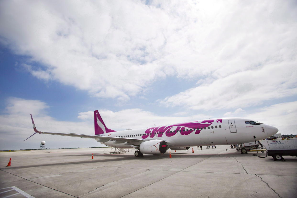 Swoop Airlines Boeing 737 on display during their media event, Tuesday, June 19, 2018 at John C. Munro International Airport in Hamilton, Ont. THE CANADIAN PRESS/Tara Walton