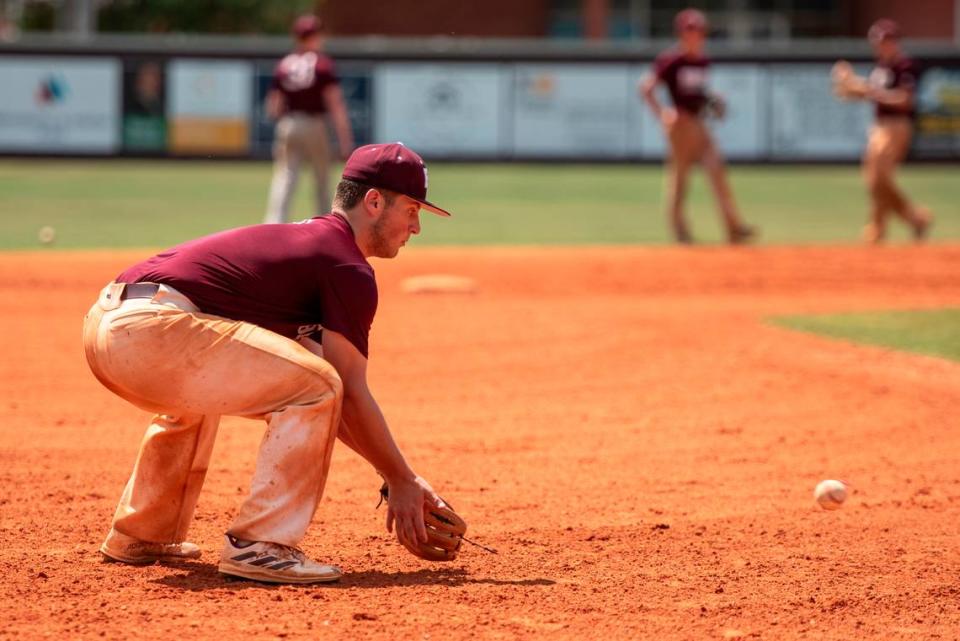 East Central infielder Nate Trochessett catches a ground ball during practice at East Central High School in Hurley on Tuesday, April 30, 2024.