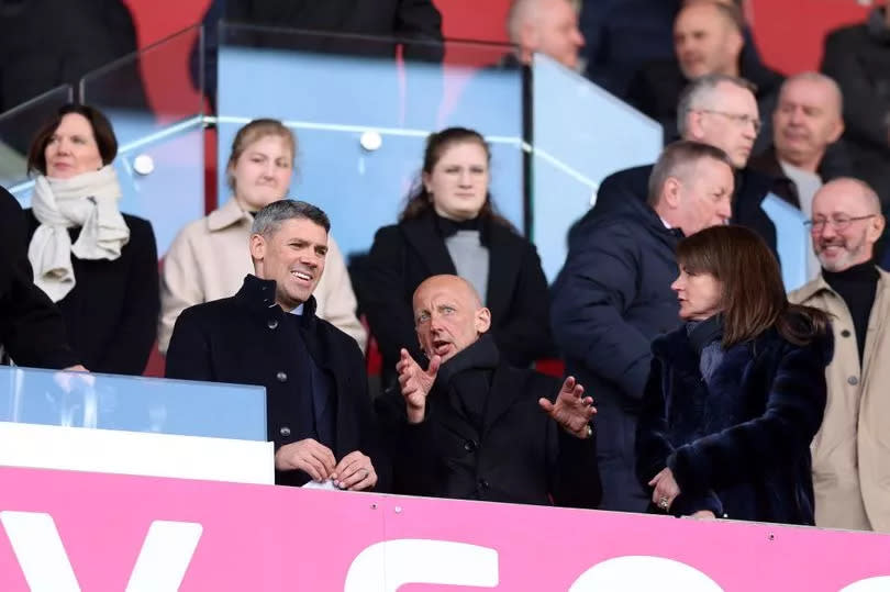 Jon Walters, Stoke City's new sporting director, watches on with chairman John Coates.