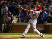 October 13, 2015; Chicago, IL, USA; St. Louis Cardinals third baseman Matt Carpenter (13) hits a single against Chicago Cubs in game four of the NLDS at Wrigley Field. Mandatory Credit: Jerry Lai-USA TODAY Sports