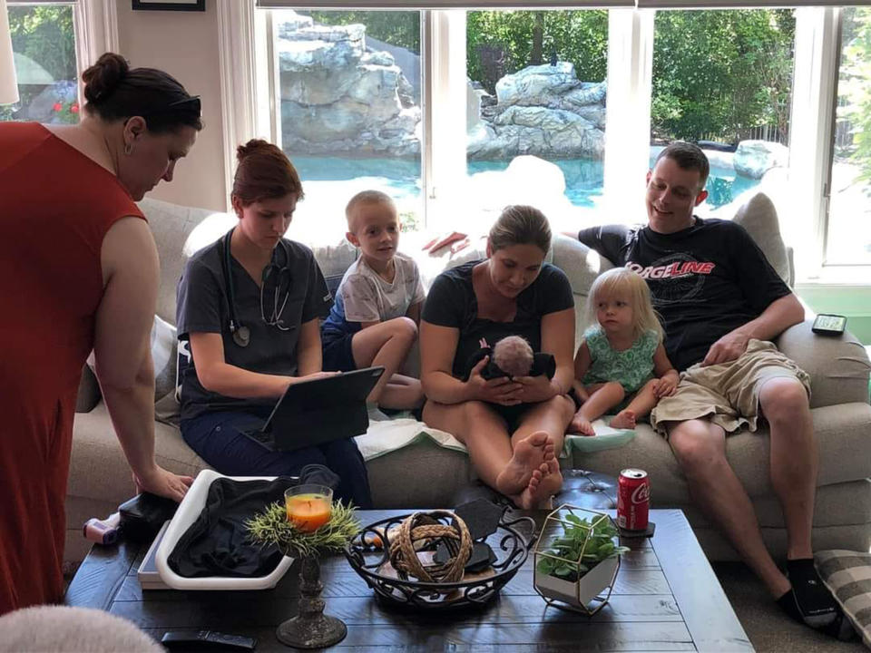 In a calmer moment at home, Heather Skaats and the family admire the new baby. (Heather Skaats)