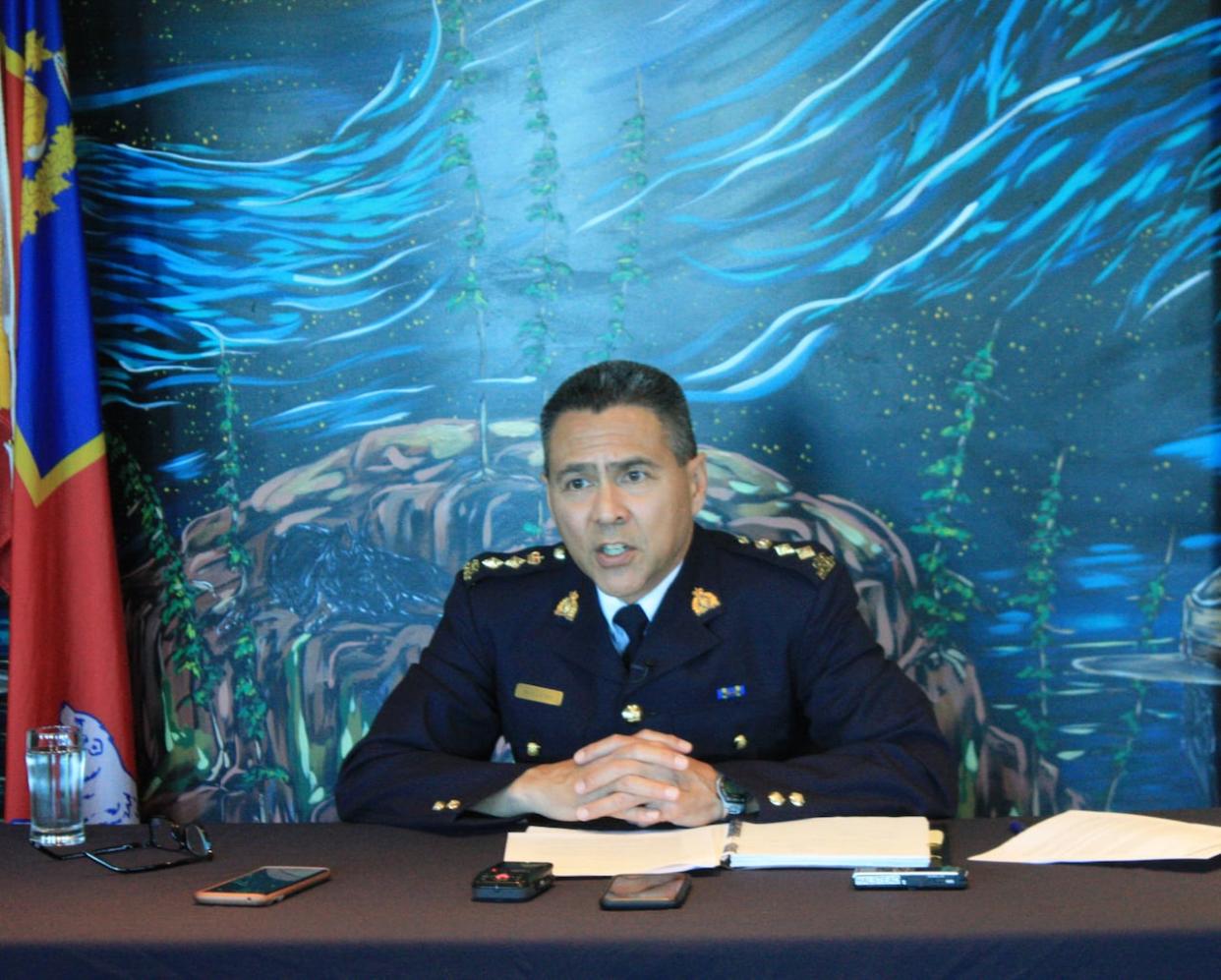 Chief Supt. Sydney Lecky, the head of the RCMP in the Northwest Territories, talks to media in Yellowknife in June 2023. Lecky is leaving the territory to take on a new job this month in Ontario.  (Emily Blake/CP - image credit)