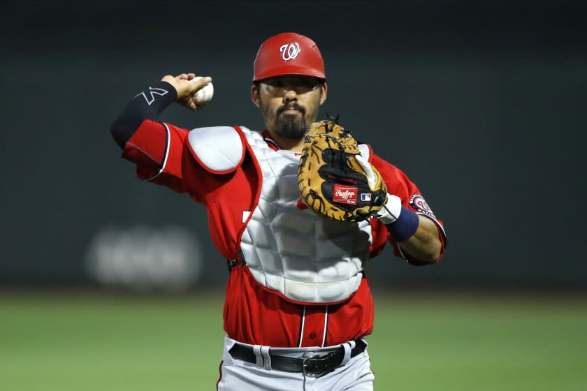 Washington Nationals catcher Kurt Suzuki works out prior to a spring training baseball game.