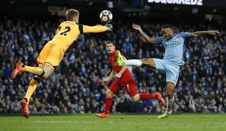 Britain Soccer Football - Manchester City v Liverpool - Premier League - Etihad Stadium - 19/3/17 Manchester City's Raheem Sterling shoots at goal as Liverpool's Simon Mignolet challenges Reuters / Andrew Yates Livepic