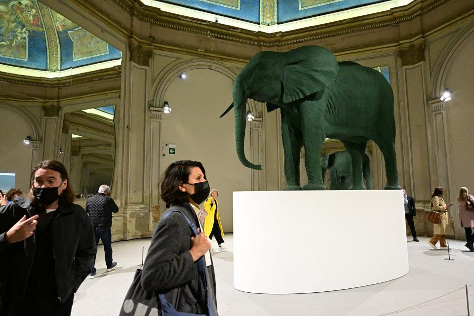 Visitors view "Elephant, 1987" by German artist Katarina Fritsch in the Central Pavilion for The Milk of Dreams at the 59th Venice Art Biennale