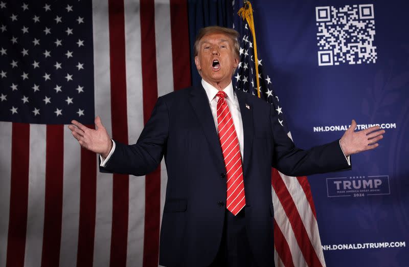 Former U.S. President and Republican presidential candidate Donald Trump gestures at rally in advance of the New Hampshire primary election in Laconia