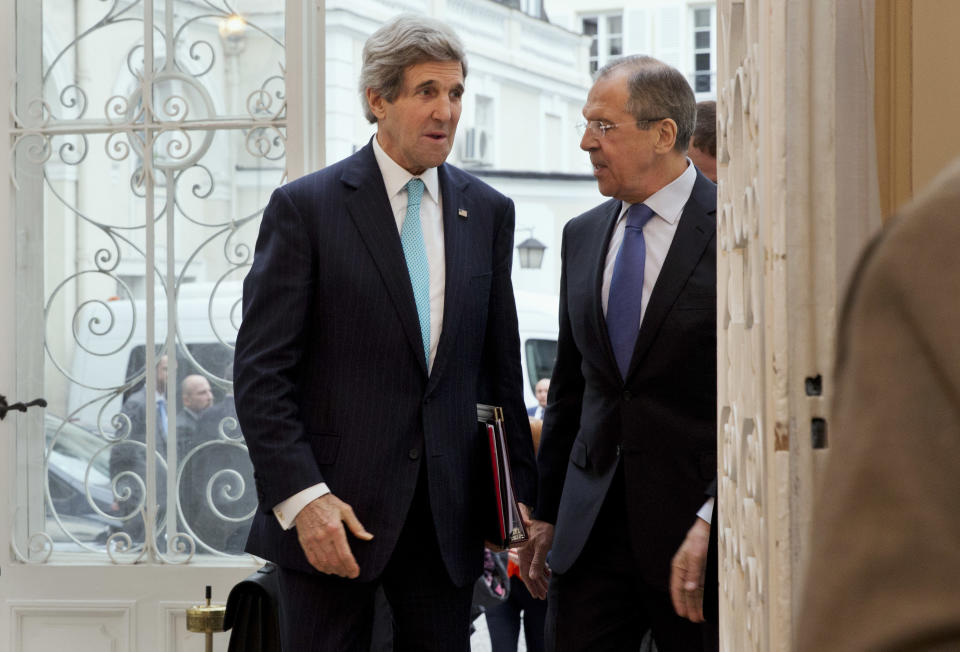 In this March 30, 2014, photo, U.S. Secretary of State John Kerry, left, is greeted by Russian Foreign Minister Sergey Lavrov at the Russian Ambassador's Residence to discuss the situation in Ukraine, in Paris. The current trip was to have been a five-day trip to Europe and Saudi Arabia, but with crisis on multiple fronts and Kerry’s decision on how to proceed turned a routine trip abroad into a frenetic tour of high-stakes diplomacy marked by abrupt changes in plan that have come to define his 14-month tenure as secretary of state. (AP Photo/Jacquelyn Martin, Pool)